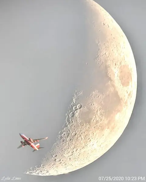 Plane Passing the Moon
